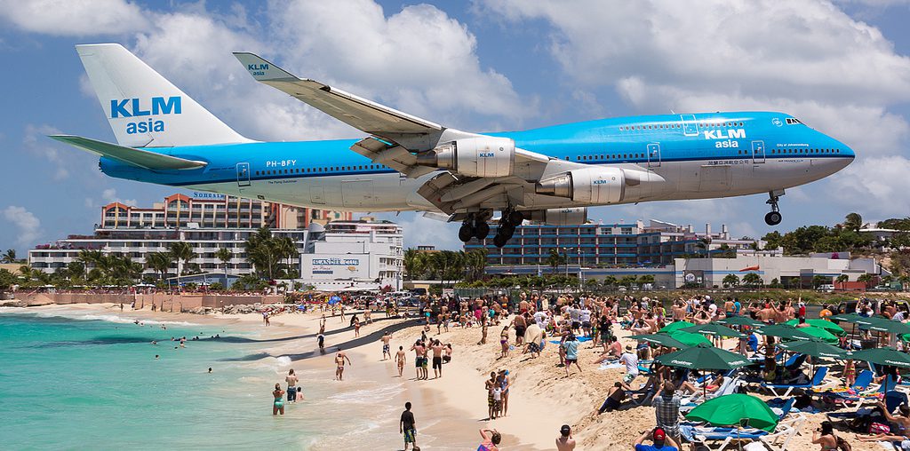KLM flight landing over the beach